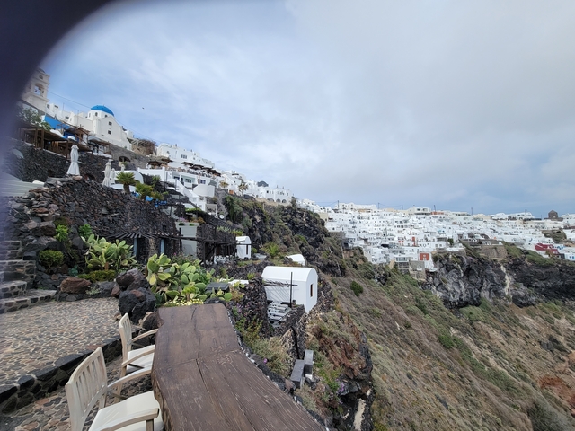 Cliffside settlement with white buildings
