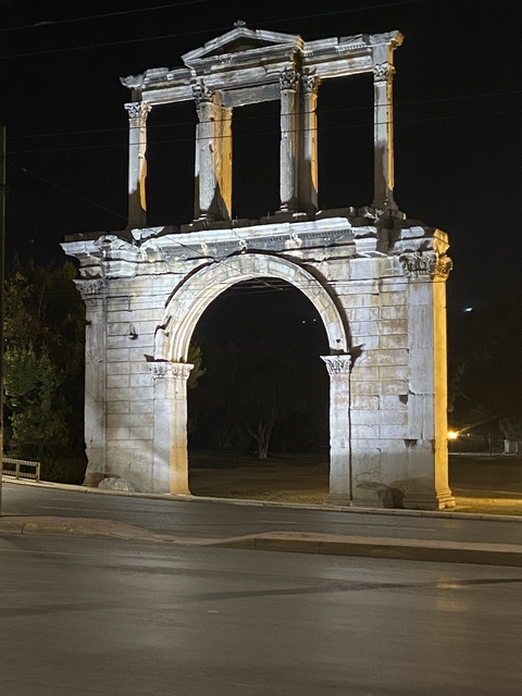 Illuminated archway at night.