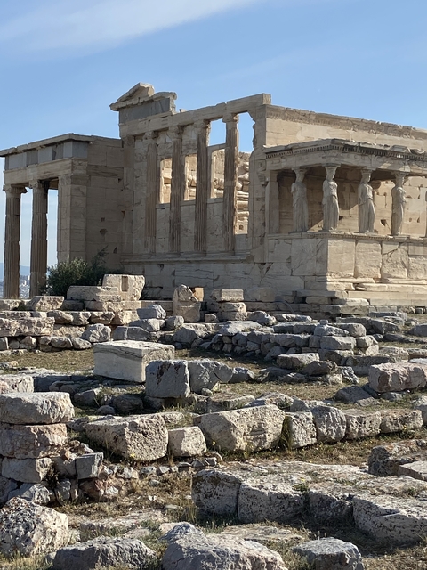 Ancient ruins with columns and statues in Athens.