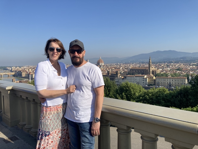 Couple posing with a panoramic view over Florence.