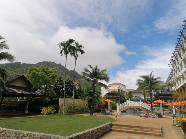 Resort pool area with mountains in the background.
