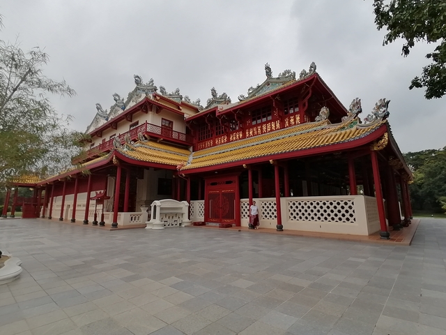 Ornate red and yellow building with traditional architecture.