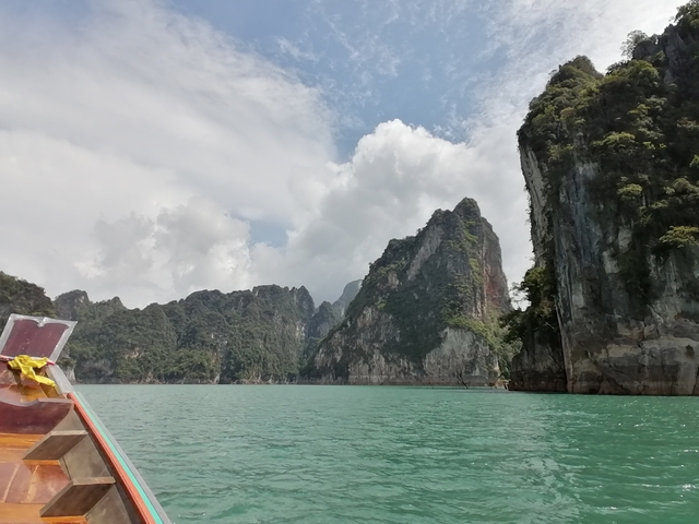 Scenic view of limestone cliffs by clear water.