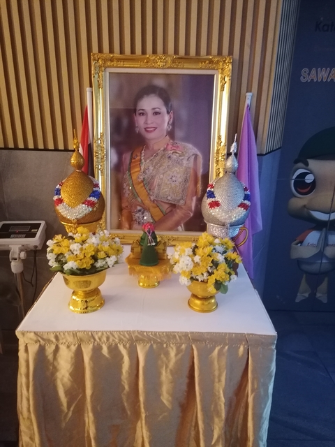 Ornate display with traditional Thai artifacts.