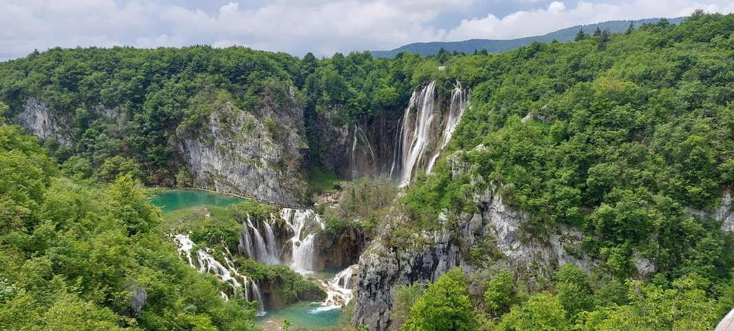 Beautiful waterfalls surrounded by lush greenery.
