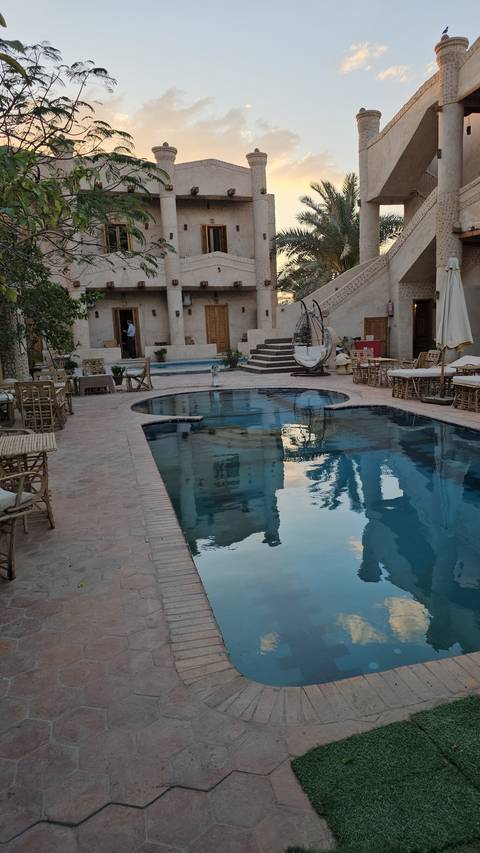 Pool and courtyard area of a hotel.