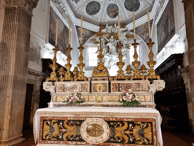Intricately designed church altar with candlesticks