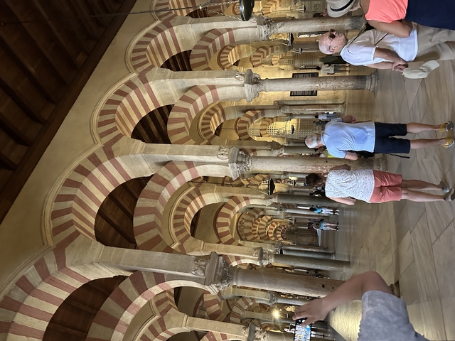 A historic mosque with iconic striped arches.