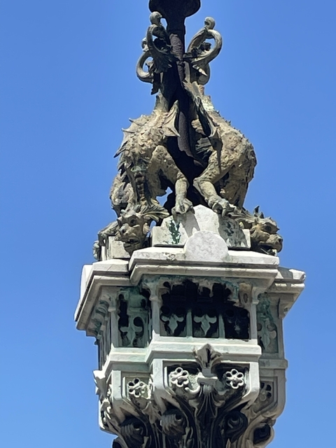 Close-up of a statue with a blue sky.