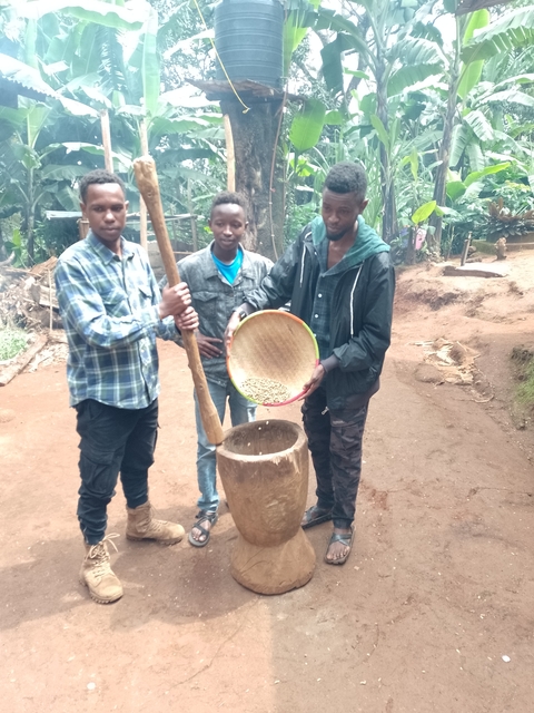 People participating in coffee production with traditional methods.