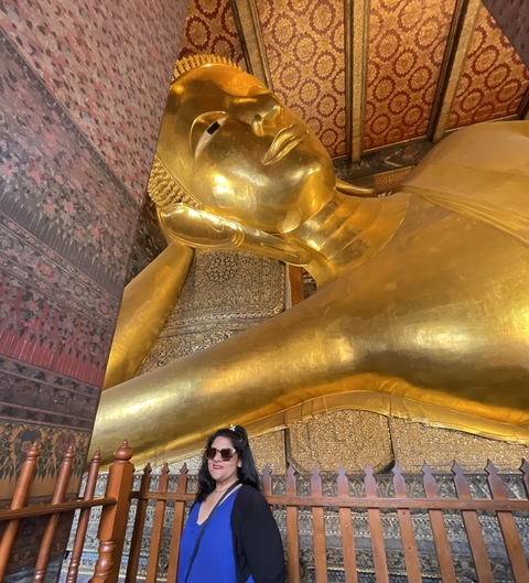 Large reclining Buddha statue in a temple.