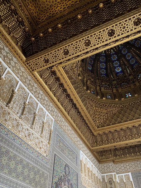 Beautifully decorated ceiling and walls inside a building.