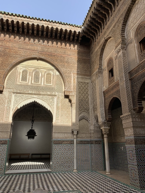 Intricate geometric patterns on a historical building's wall.