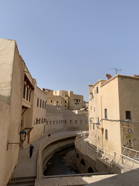 Traditional beige buildings with a clear sky background.