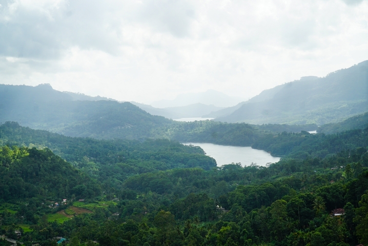 Scenic view of lush green hills and a winding river.