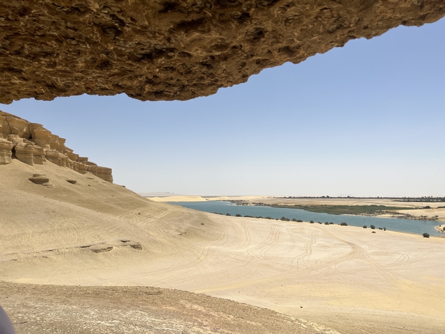 Desert landscape with a river running through it.