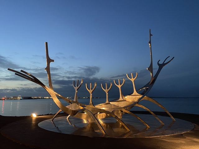 Sculpture at the water's edge during twilight in Reykjavik.