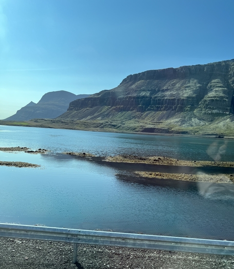 Scenic fjord with mountains and water.