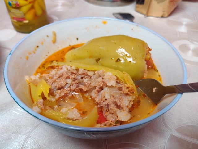 Soup with stuffed peppers in a bowl.