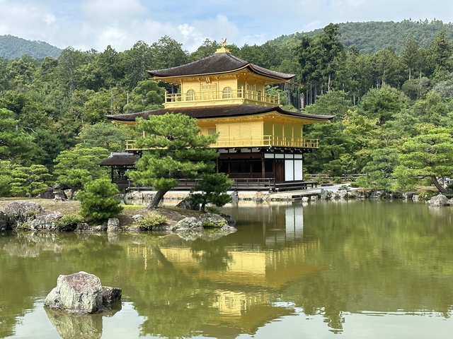 Kinkaku-ji, the Golden Pavilion, reflecting in a pond.