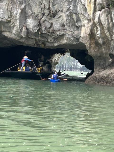Upside-down image of kayaks in a cave.