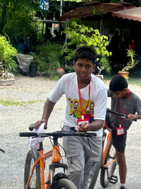 Upside-down image of a child riding a bicycle.