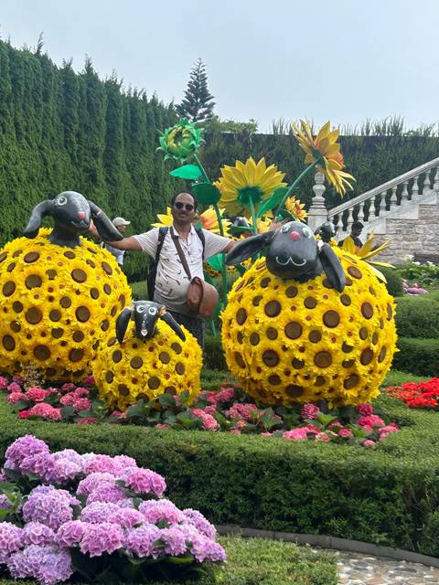 Upside-down image of a person with decorative sunflowers.