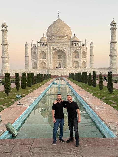 Two men in front of the Taj Mahal.