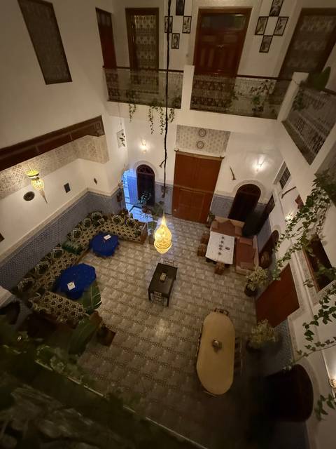 Interior courtyard with traditional Moroccan decor and seating.