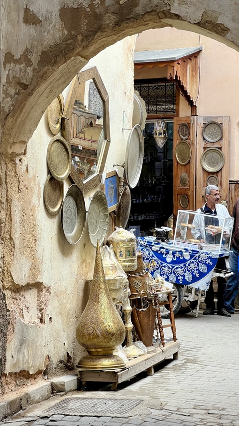 Market scene with traditional goods and a vendor.