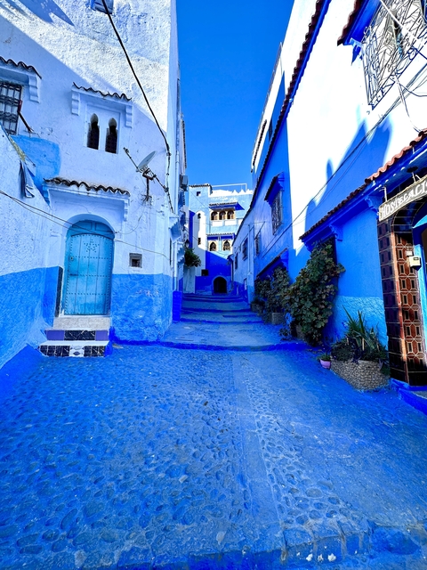 Vibrant blue-painted streets of a traditional city.