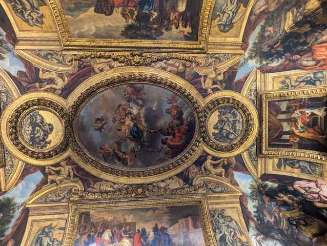 Ornate painted ceiling of a historic palace.
