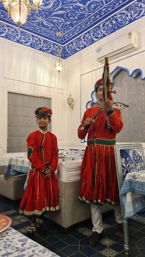 Musicians in traditional attire performing.