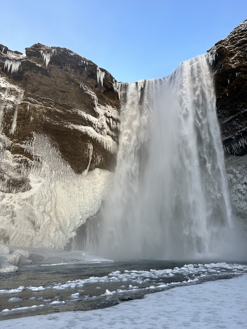 A close-up of a partially frozen waterfall.