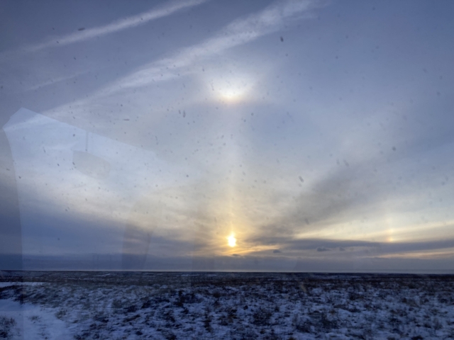 Light phenomenon in the sky during a snowy landscape.