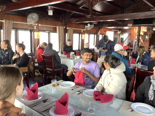 People dining inside a boat or restaurant.