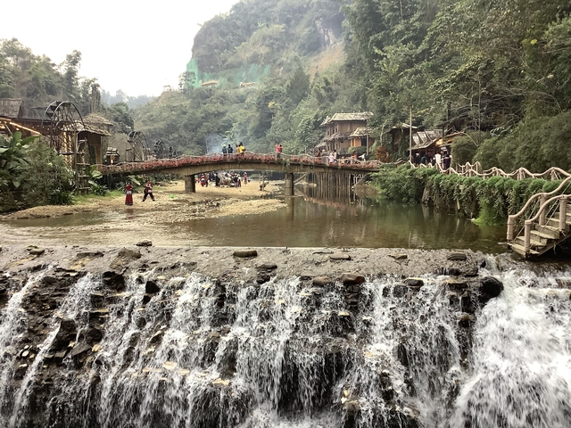 Bridge over a stream in a scenic rural area.