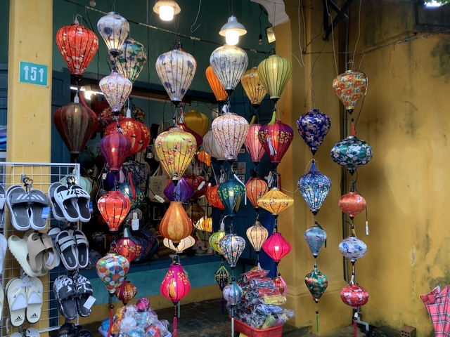 Colorful lanterns hanging in a shop.