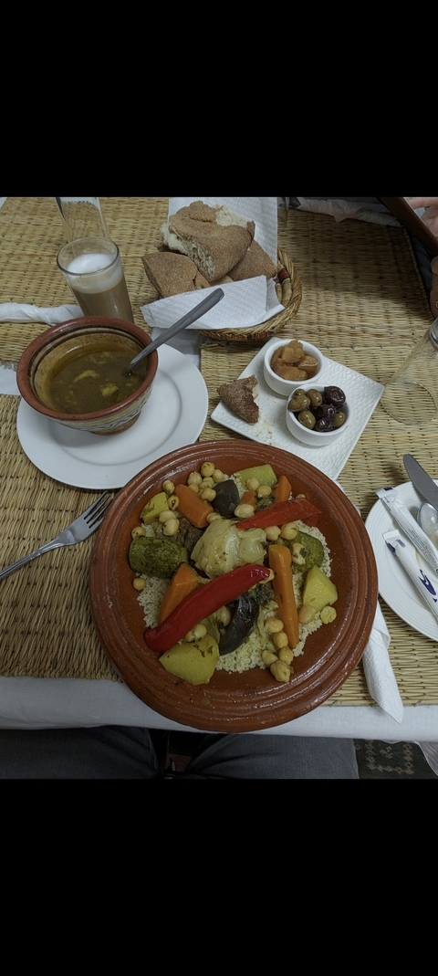 Moroccan couscous served with vegetables, chickpeas, and meat.