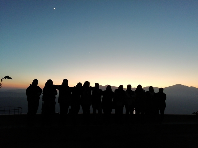 Silhouette of people during a sunset.