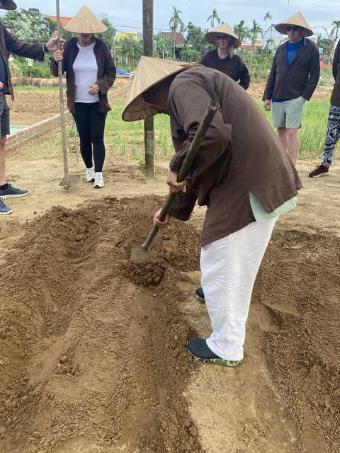 Person engaging in farming activity.