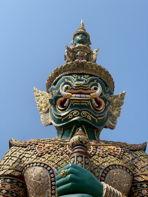 Intricately decorated statue of a mythical creature.