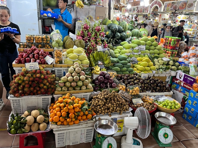 Market stall with a variety of colorful tropical fruits.