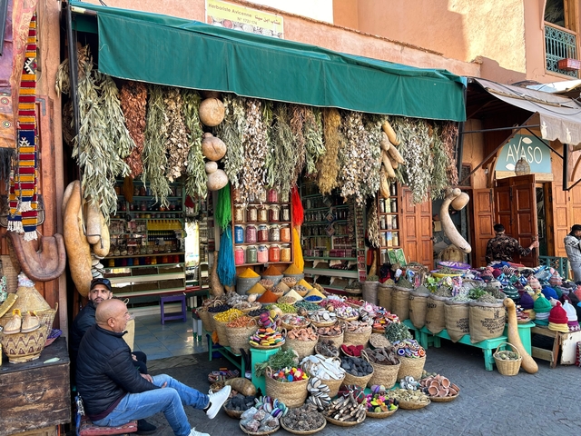 Vibrant spice and herb store with bags of spices.