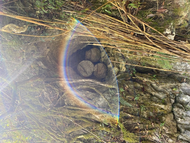Cave entrance with rock formations.
