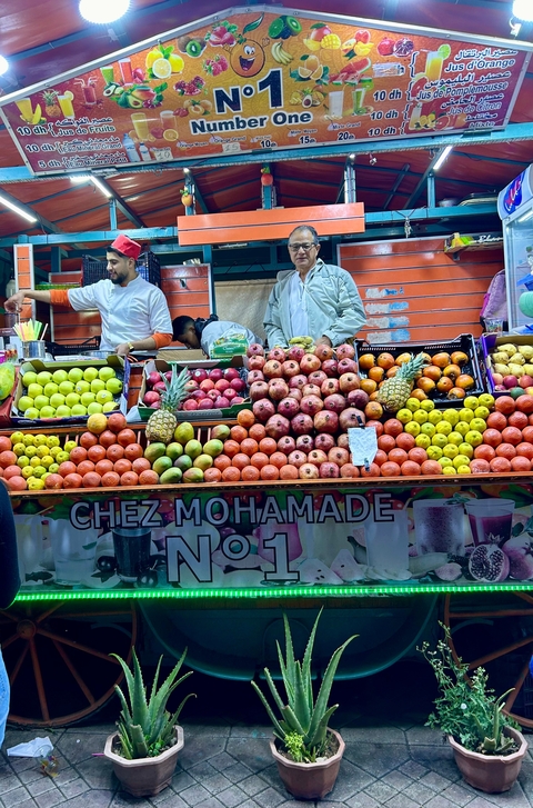Fruit vendors at a market stall.