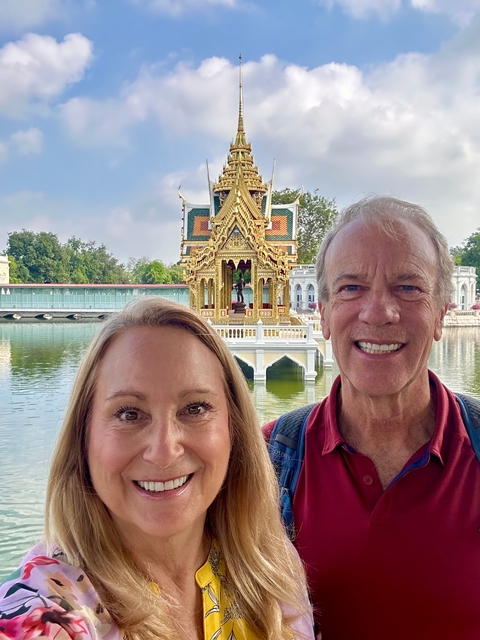 Couple posing in front of a beautifully detailed temple.