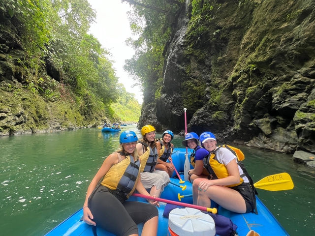 Group of people enjoying rafting in a canyon.