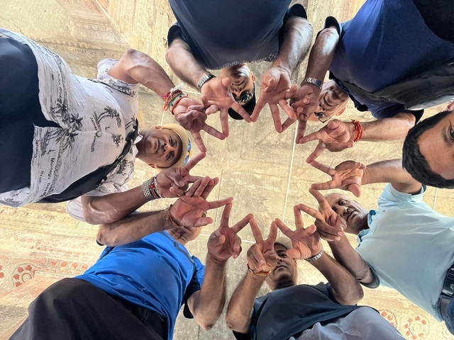Group forming star shape with their hands.