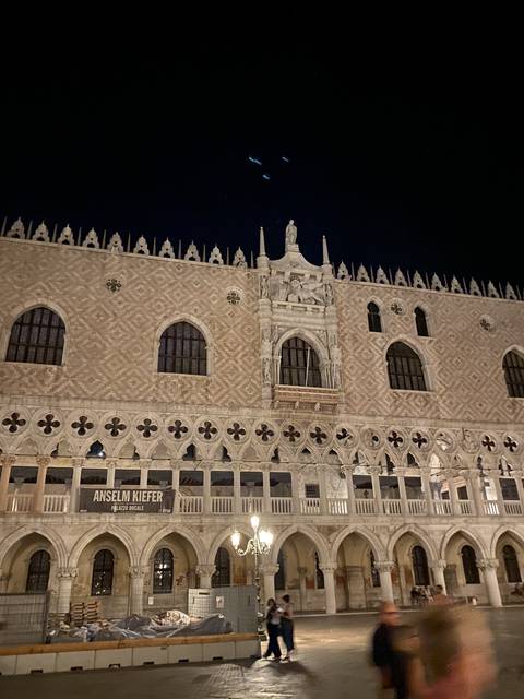 Night view of a gothic building with dramatic lighting.